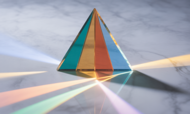 A colorful prism casting light in various directions
