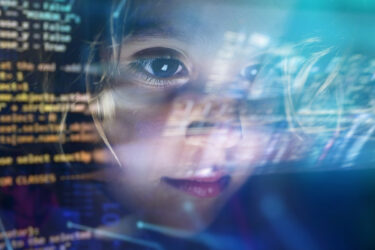 Close up of a little girl looking at some futuristic holograms. Concept: Technology, future, graphics