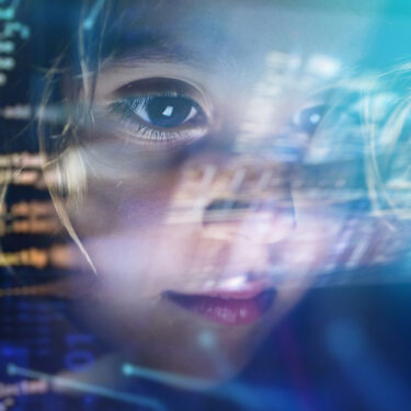 Close up of a little girl looking at some futuristic holograms. Concept: Technology, future, graphics
